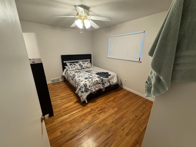 13497 Mark St, Southgate, MI 48195 - bedroom with wood finished floors, ceiling fan, and baseboards