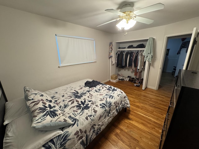 13497 Mark St, Southgate, MI 48195 - bedroom with a closet, wood finished floors, a ceiling fan, and baseboards