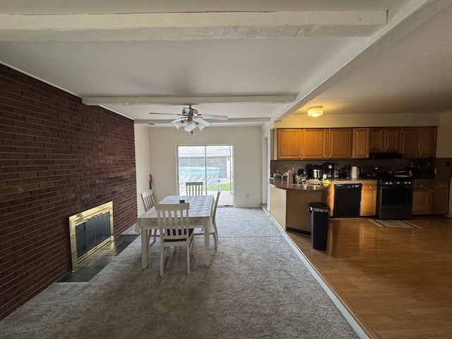 13497 Mark St, Southgate, MI 48195 - dining room with brick wall, beam ceiling, a fireplace, wood finished floors, and ceiling fan