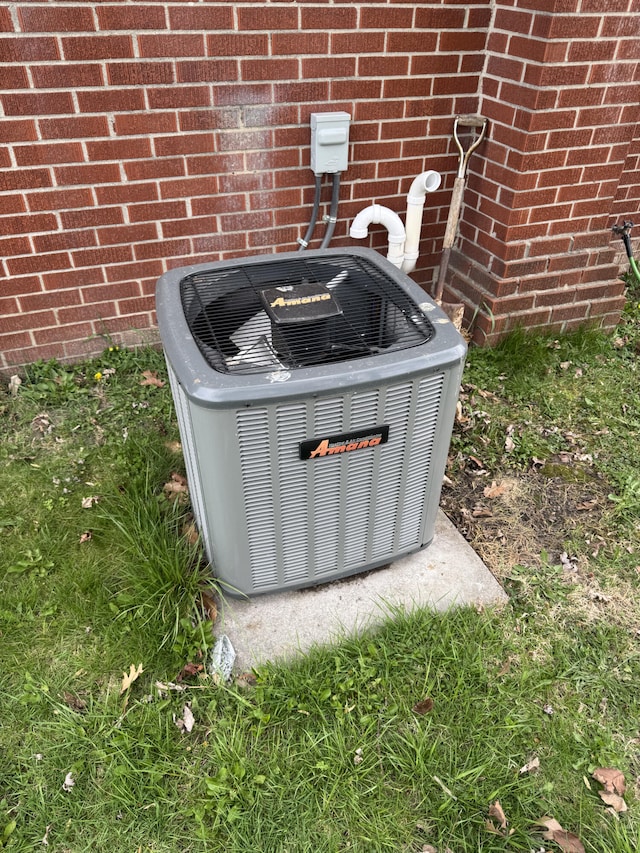 13497 Mark St, Southgate, MI 48195 - exterior view of central air condition unit and brick siding