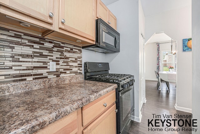 258 Ann St NE, Grand Rapids, MI 49505 - kitchen with black appliances, light brown cabinets, backsplash, a chandelier, and dark wood-style flooring