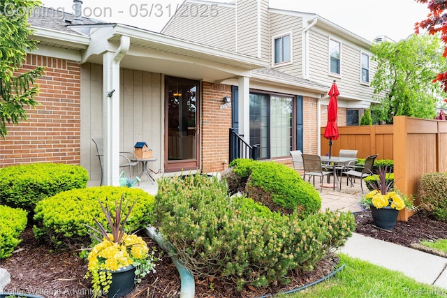 22152 Edgewater, Novi, MI 48375 - view of exterior entry with brick siding and a patio area