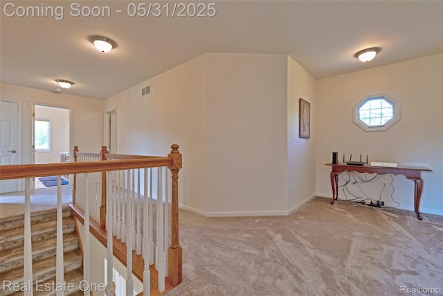 1572 S Hadley Rd, Ortonville, MI 48462 - corridor featuring carpet floors, baseboards, and an upstairs landing