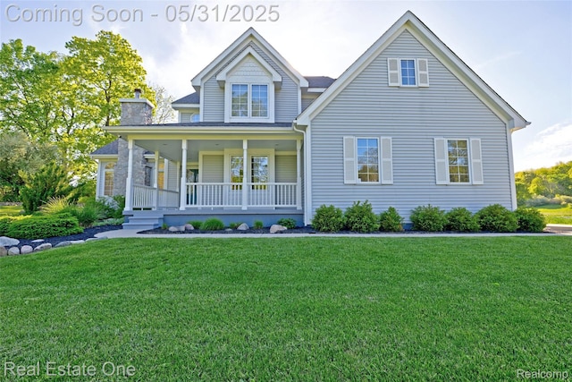 1572 S Hadley Rd, Ortonville, MI 48462 - view of front of property with covered porch, a front yard, and a chimney