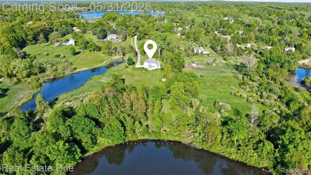 1572 S Hadley Rd, Ortonville, MI 48462 - bird's eye view of a large body of water and a forest