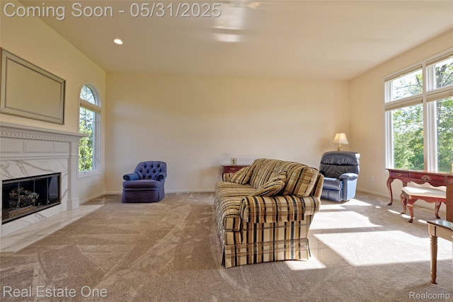 1572 S Hadley Rd, Ortonville, MI 48462 - living area with plenty of natural light, carpet, baseboards, a premium fireplace, and recessed lighting