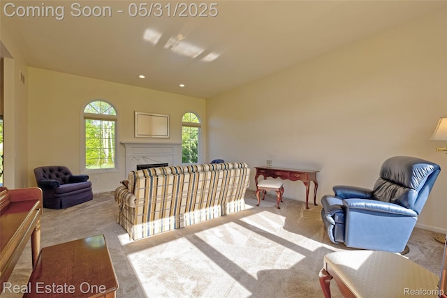 1572 S Hadley Rd, Ortonville, MI 48462 - living area featuring carpet floors, baseboards, a high end fireplace, and recessed lighting
