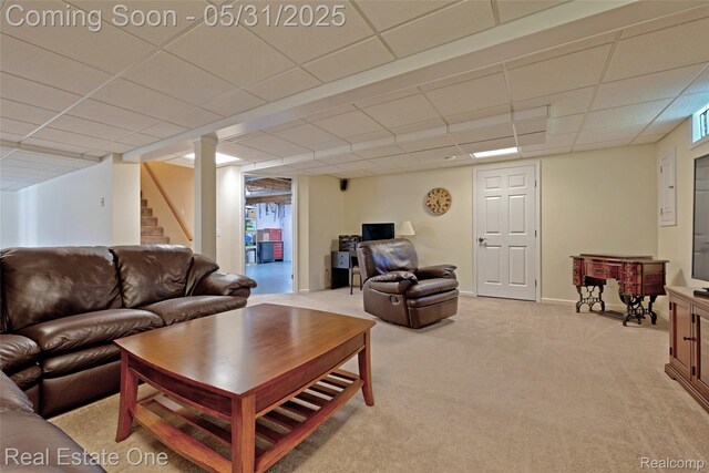 1572 S Hadley Rd, Ortonville, MI 48462 - living area with a drop ceiling, light colored carpet, and stairs