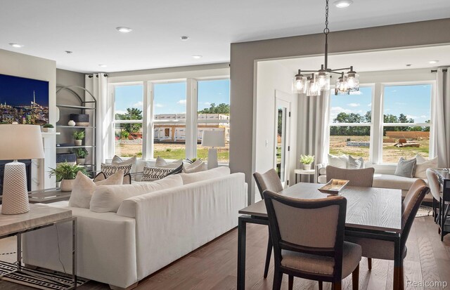 1777 Addison Cir, Walled Lake, MI 48390 - dining space with wood finished floors, a chandelier, and recessed lighting