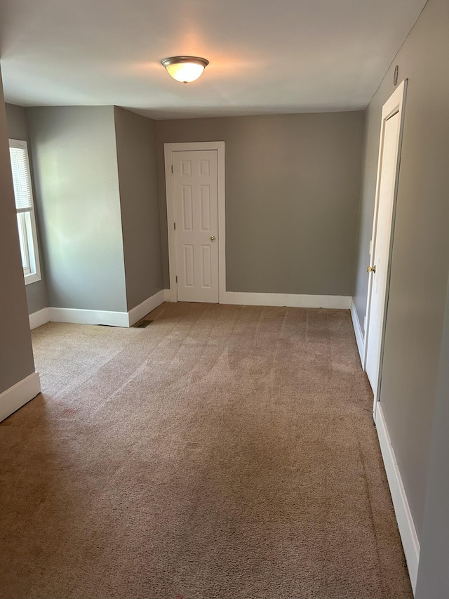 94 E Burnham St, Battle Creek, MI 49015 - spare room featuring carpet flooring and baseboards