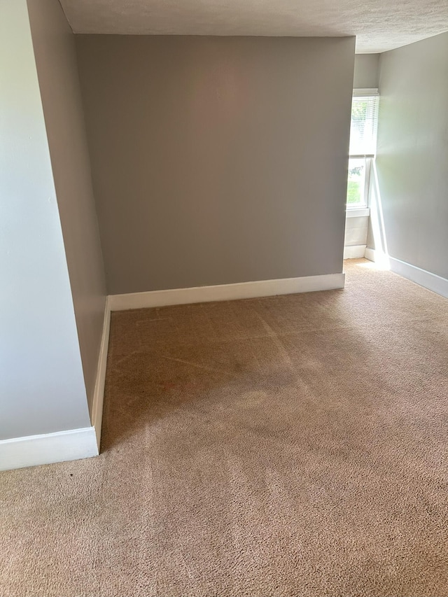 94 E Burnham St, Battle Creek, MI 49015 - empty room with carpet flooring and baseboards
