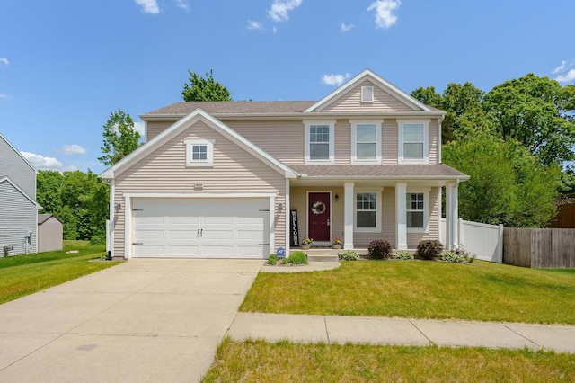 10126 Castle Creek Cir, Galesburg, MI 49053 - traditional home with driveway, covered porch, and an attached garage