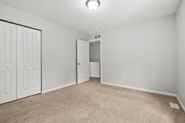 10126 Castle Creek Cir, Galesburg, MI 49053 - unfurnished bedroom featuring carpet, a closet, and baseboards