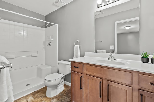 10126 Castle Creek Cir, Galesburg, MI 49053 - full bath featuring vanity, a shower, stone finish floors, and toilet
