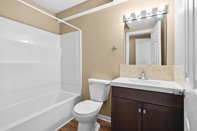 10126 Castle Creek Cir, Galesburg, MI 49053 - full bathroom featuring vanity, toilet, wood finished floors, bathing tub / shower combination, and baseboards