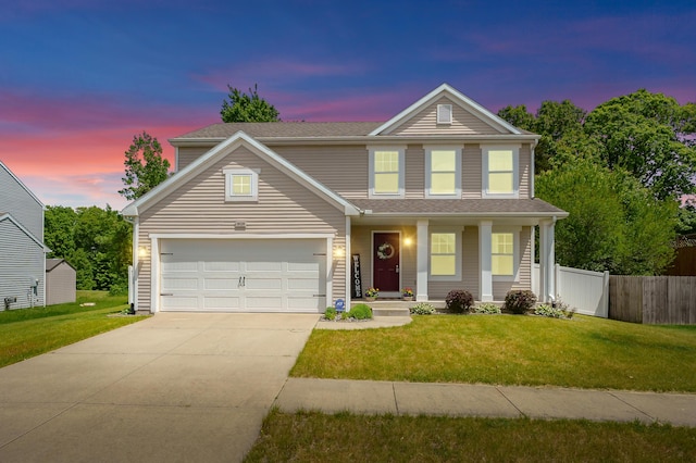 10126 Castle Creek Cir, Galesburg, MI 49053 - traditional-style house featuring driveway, covered porch, a garage, and a shingled roof