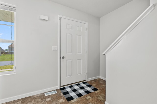 10126 Castle Creek Cir, Galesburg, MI 49053 - foyer entrance featuring stone finish floors and baseboards