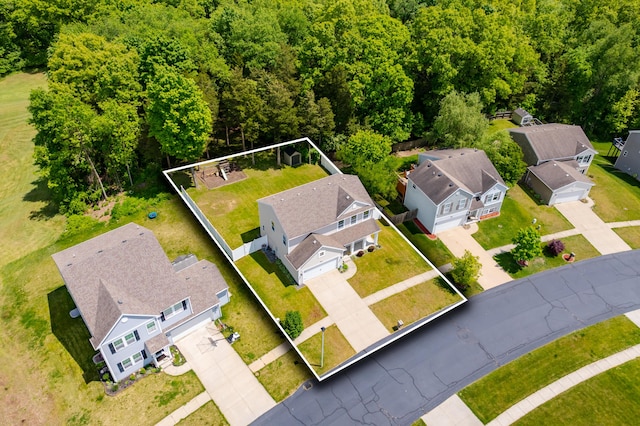 10126 Castle Creek Cir, Galesburg, MI 49053 - aerial perspective of suburban area featuring property parcel outlined and a heavily wooded area