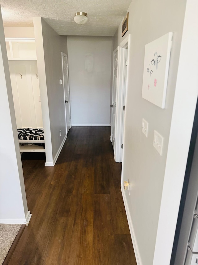 8287 Falkirk Dr, Indiana, IN 46123 - corridor featuring wood finished floors, baseboards, and a textured ceiling