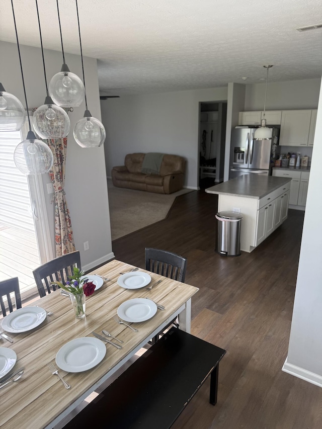 8287 Falkirk Dr, Indiana, IN 46123 - dining space featuring dark wood finished floors and a textured ceiling