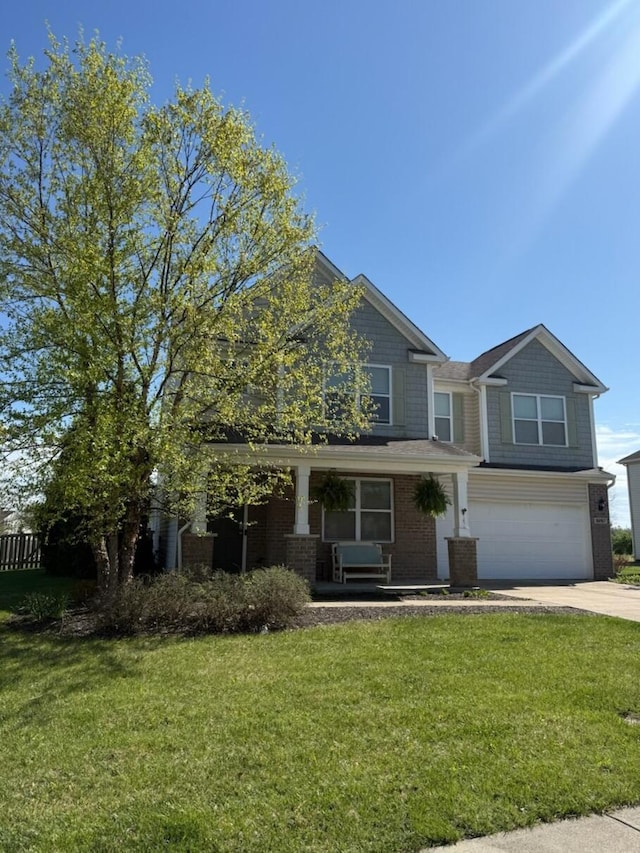 8287 Falkirk Dr, Indiana, IN 46123 - view of front of property featuring an attached garage, driveway, a front lawn, and brick siding