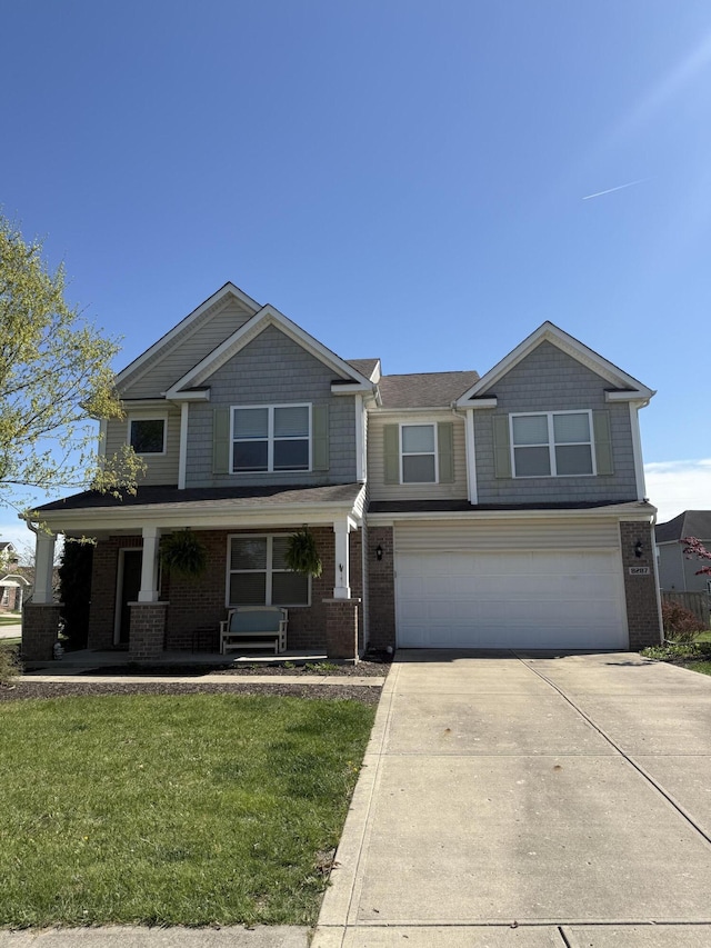 8287 Falkirk Dr, Indiana, IN 46123 - craftsman-style house with driveway, an attached garage, a porch, brick siding, and a front lawn