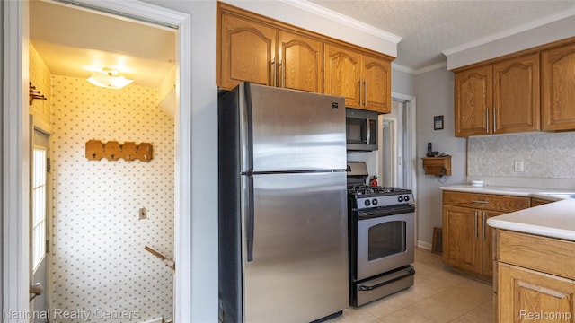 3446 17th St, Wyandotte, MI 48192 - kitchen featuring stainless steel appliances, brown cabinetry, ornamental molding, light countertops, and light tile patterned flooring