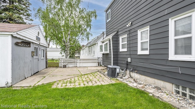 3446 17th St, Wyandotte, MI 48192 - view of yard featuring a patio and central air condition unit