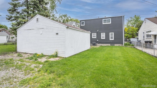 3446 17th St, Wyandotte, MI 48192 - back of house with an outbuilding and central AC unit