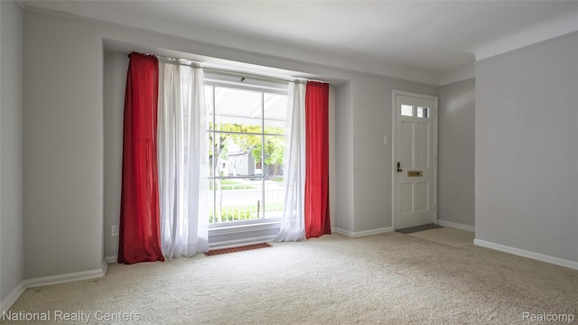 3446 17th St, Wyandotte, MI 48192 - foyer featuring carpet floors and baseboards
