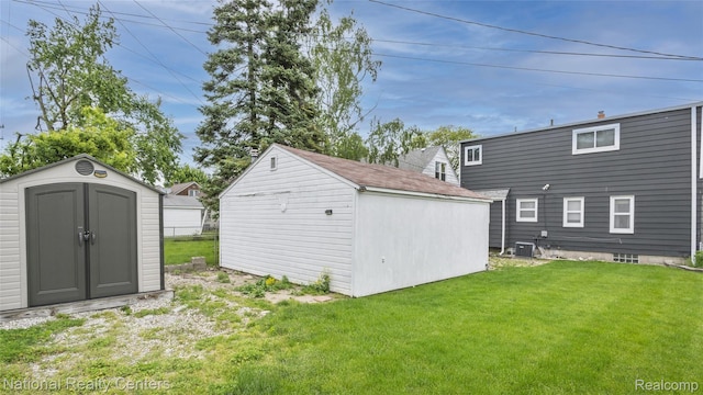 3446 17th St, Wyandotte, MI 48192 - rear view of house with a lawn and cooling unit