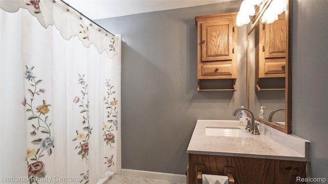 3446 17th St, Wyandotte, MI 48192 - bathroom featuring vanity, marble finish flooring, curtained shower, and baseboards