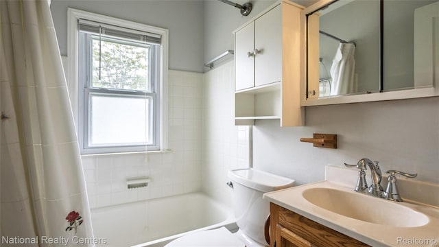 3446 17th St, Wyandotte, MI 48192 - bathroom featuring toilet, vanity, and shower / tub combo with curtain