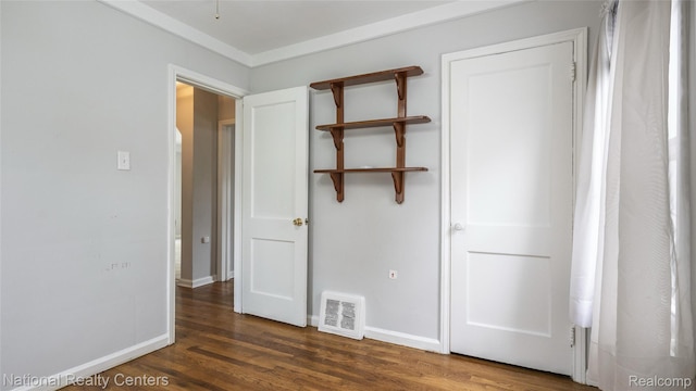 3446 17th St, Wyandotte, MI 48192 - unfurnished bedroom with wood finished floors and baseboards