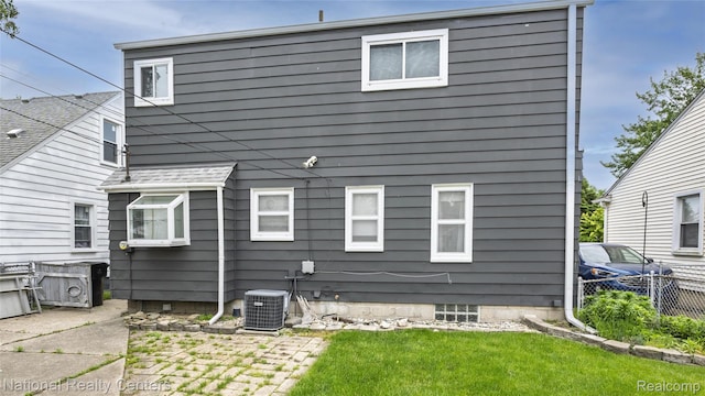 3446 17th St, Wyandotte, MI 48192 - back of house with cooling unit and a patio