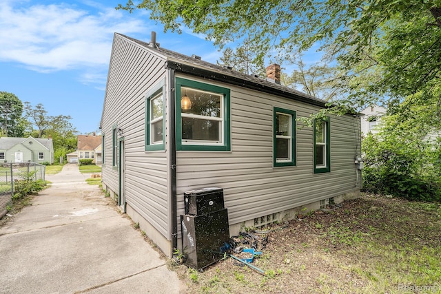 15500 Strathmoor St, Detroit, MI 48227 - view of side of property featuring a chimney