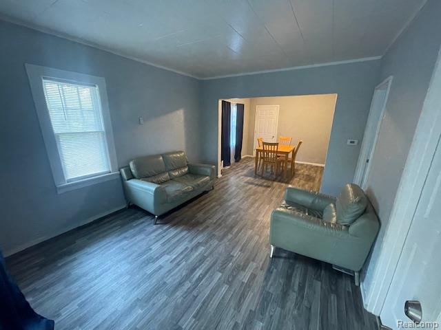 1010 S Garden St, Flint, MI 48503 - living area featuring wood finished floors and ornamental molding