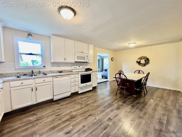 1865 Range Rd, Kimball, MI 48074 - kitchen with white appliances, a sink, wood finished floors, and decorative backsplash
