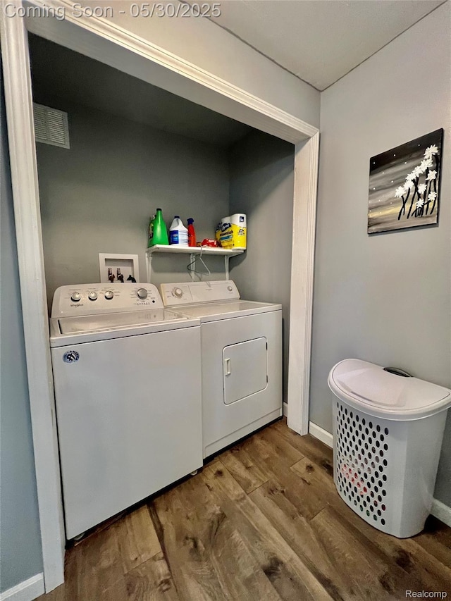 1865 Range Rd, Kimball, MI 48074 - laundry room featuring wood finished floors, independent washer and dryer, and baseboards