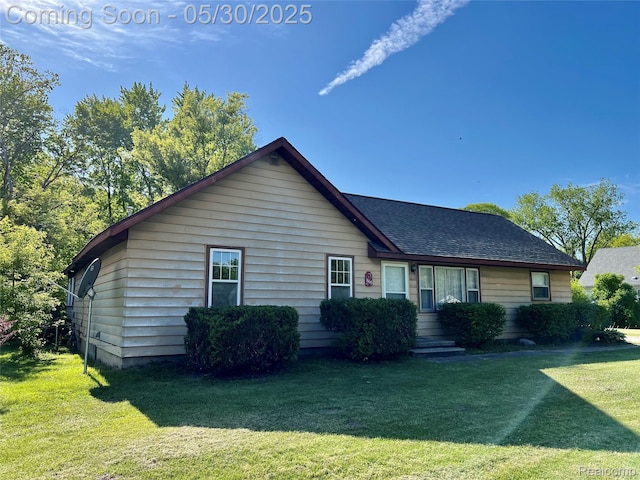 1865 Range Rd, Kimball, MI 48074 - view of front facade with a front lawn and a shingled roof