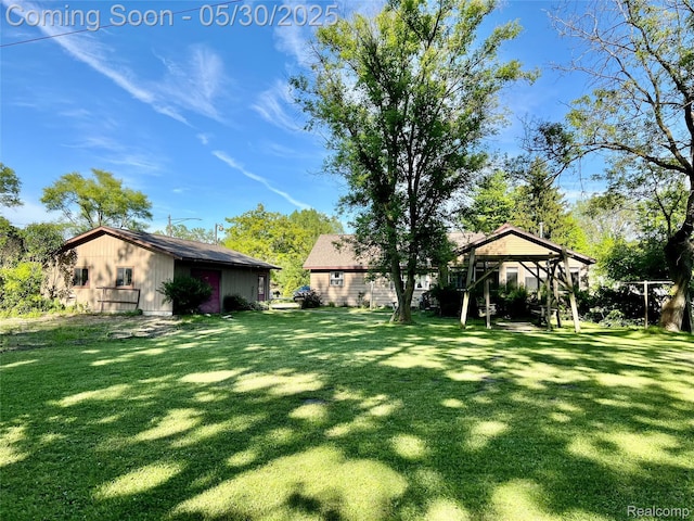 1865 Range Rd, Kimball, MI 48074 - view of green lawn with an outdoor structure