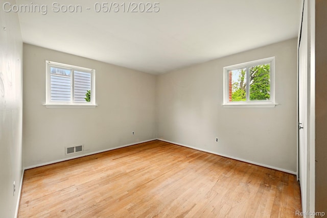 14846 Lakewood Dr, Plymouth, MI 48170 - empty room with wood finished floors and baseboards