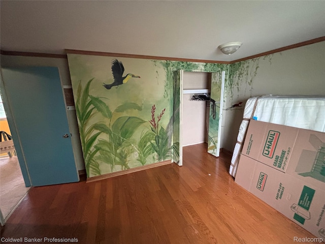 5550 25 Mile Rd, Shelby Twp, MI 48316 - unfurnished bedroom featuring wood finished floors and crown molding