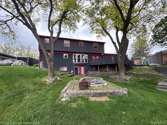 5550 25 Mile Rd, Shelby Twp, MI 48316 - back of house with a fire pit, a wooden deck, and a yard