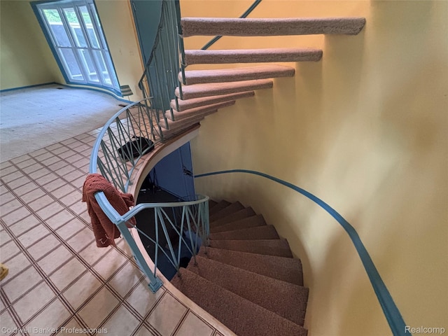 5550 25 Mile Rd, Shelby Twp, MI 48316 - staircase with carpet floors and tile patterned flooring