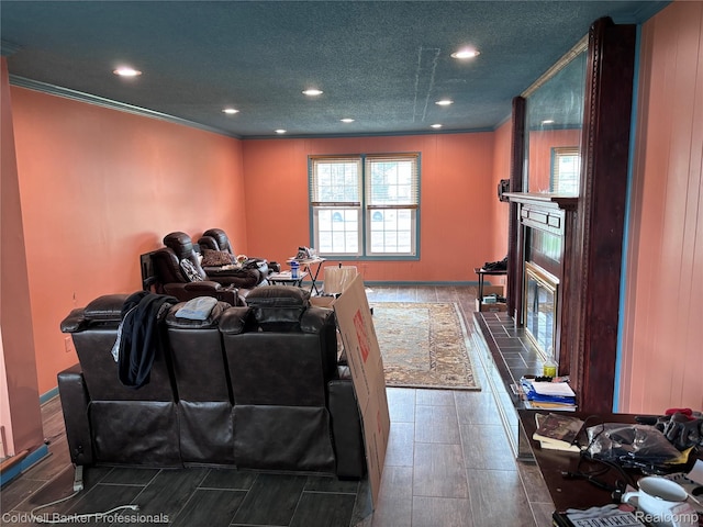 5550 25 Mile Rd, Shelby Twp, MI 48316 - home theater with ornamental molding, a tile fireplace, recessed lighting, wood finish floors, and a textured ceiling