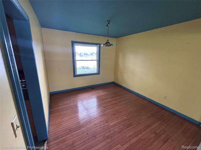 5550 25 Mile Rd, Shelby Twp, MI 48316 - empty room with hardwood / wood-style floors and baseboards
