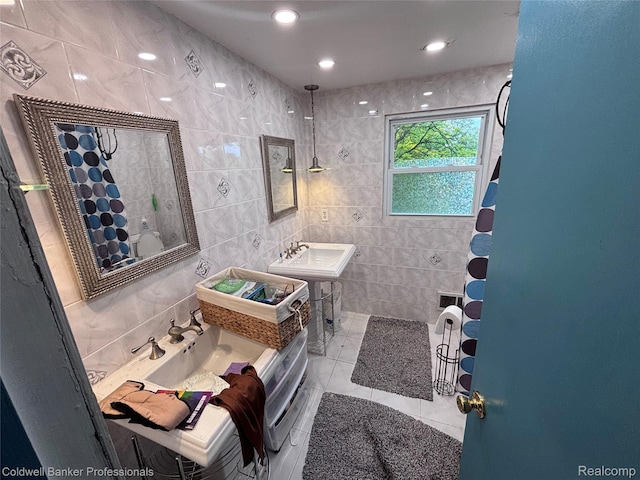 5550 25 Mile Rd, Shelby Twp, MI 48316 - full bathroom featuring tile walls, a tile shower, a sink, and tile patterned floors