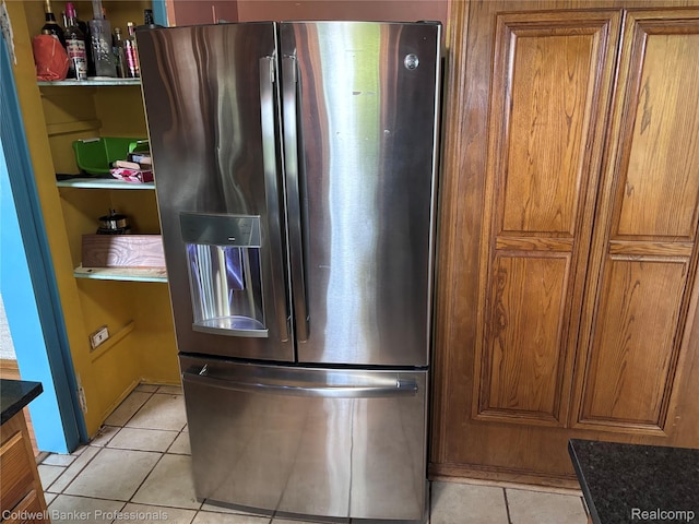 5550 25 Mile Rd, Shelby Twp, MI 48316 - kitchen featuring stainless steel fridge with ice dispenser, light tile patterned flooring, brown cabinetry, and dark countertops