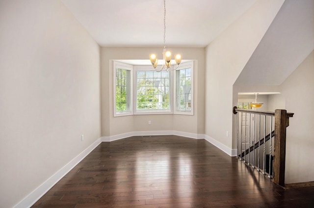 2512 W Liberty St, Ann Arbor, MI 48103 - unfurnished dining area with a chandelier, dark wood-style floors, and baseboards